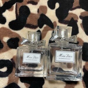 2 empty Miss Dior bottles